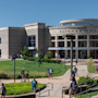 Missouri S&T students walk on campus in front of the university's Havener Center building.