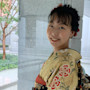 Hinako, an international student from Japan at the University of Nevada, Reno, stands near a courtyard wearing traditional dress.
