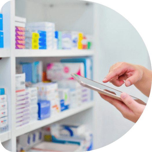 The hand of a person using a tablet at a pharmacy