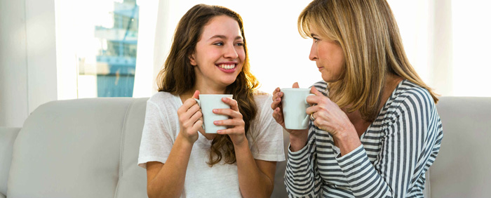 daughter with mother drinking coffee