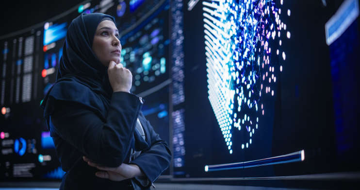 Young Arab Woman in Hijab Working in an Innovative Internet Service Company 