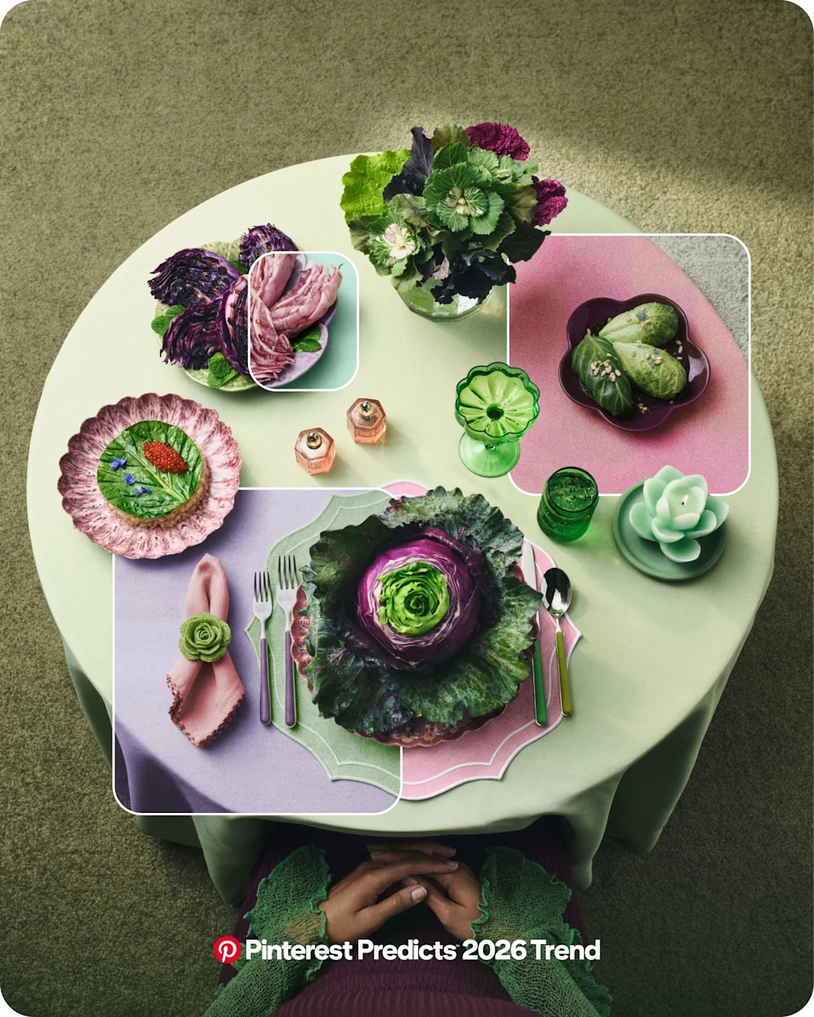 Top view of a green table displaying green and purple cabbage on five different plates with tableware.