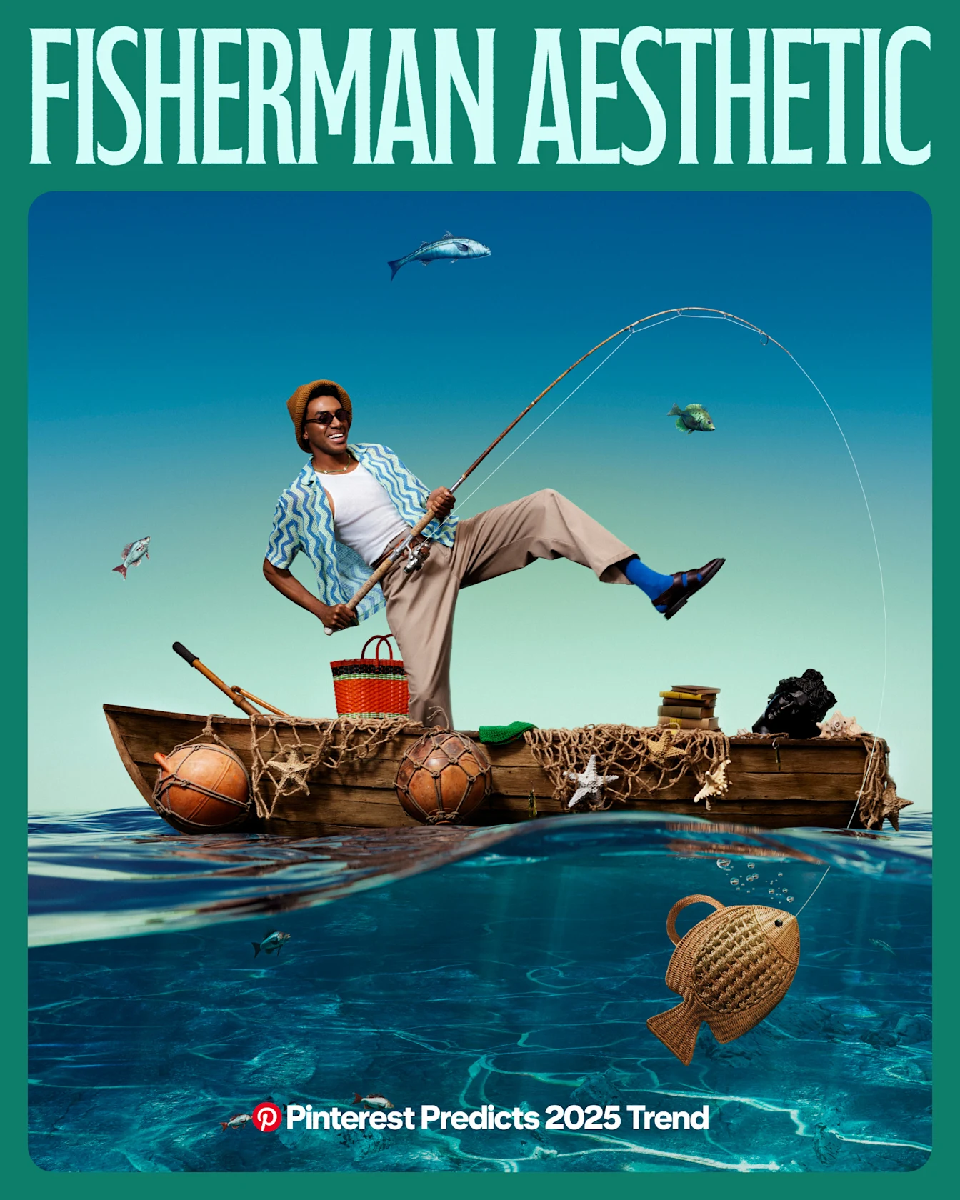 A man in khaki pants and a short sleeve button-down stands on one leg in a wooden boat. The boat is draped with fishing nets, and has a wicker goldfish-shaped clutch underneath it.