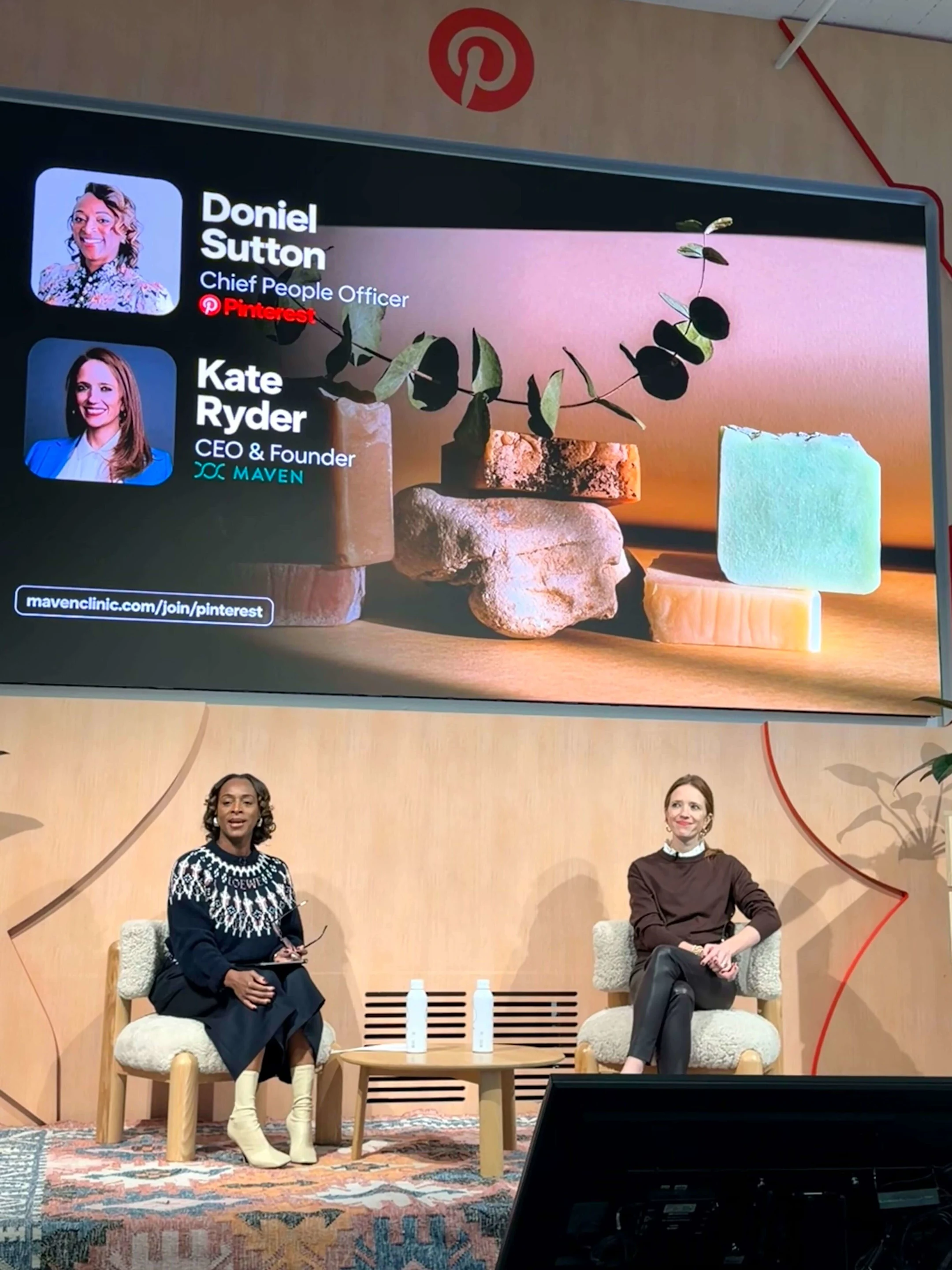 Doniel Sutton from Pinterest and Kate Ryder from Maven sit on a stage.