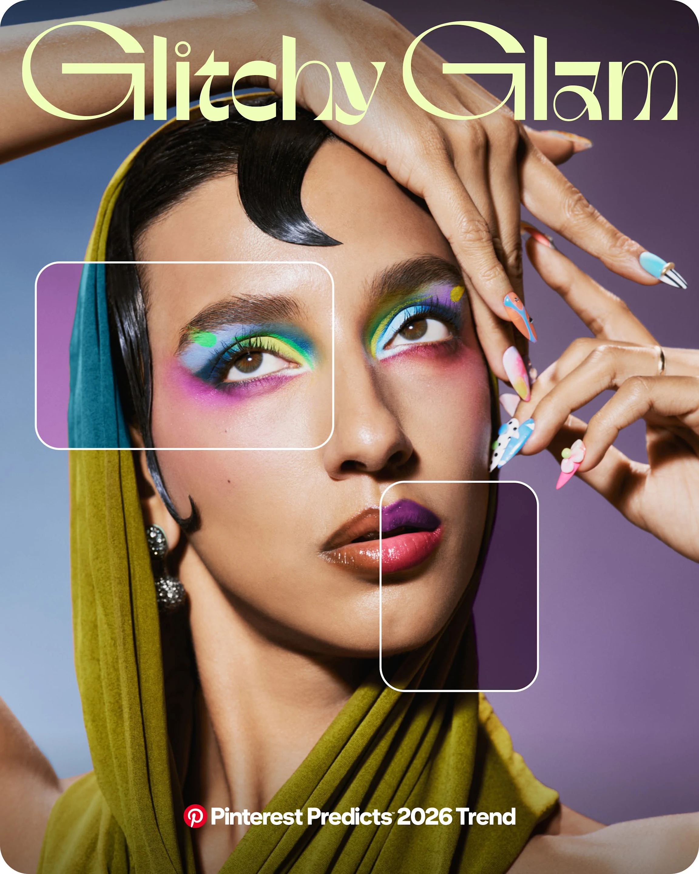 Close up on someone striking a dramatic pose while wearing a green scarf around their head. They have colourful eye makeup and fingernails.