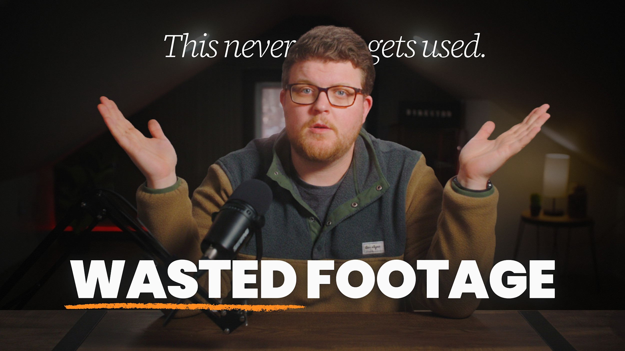 Brandon Hardy shrugs at a desk microphone under the words "Wasted footage" and "This never gets used."