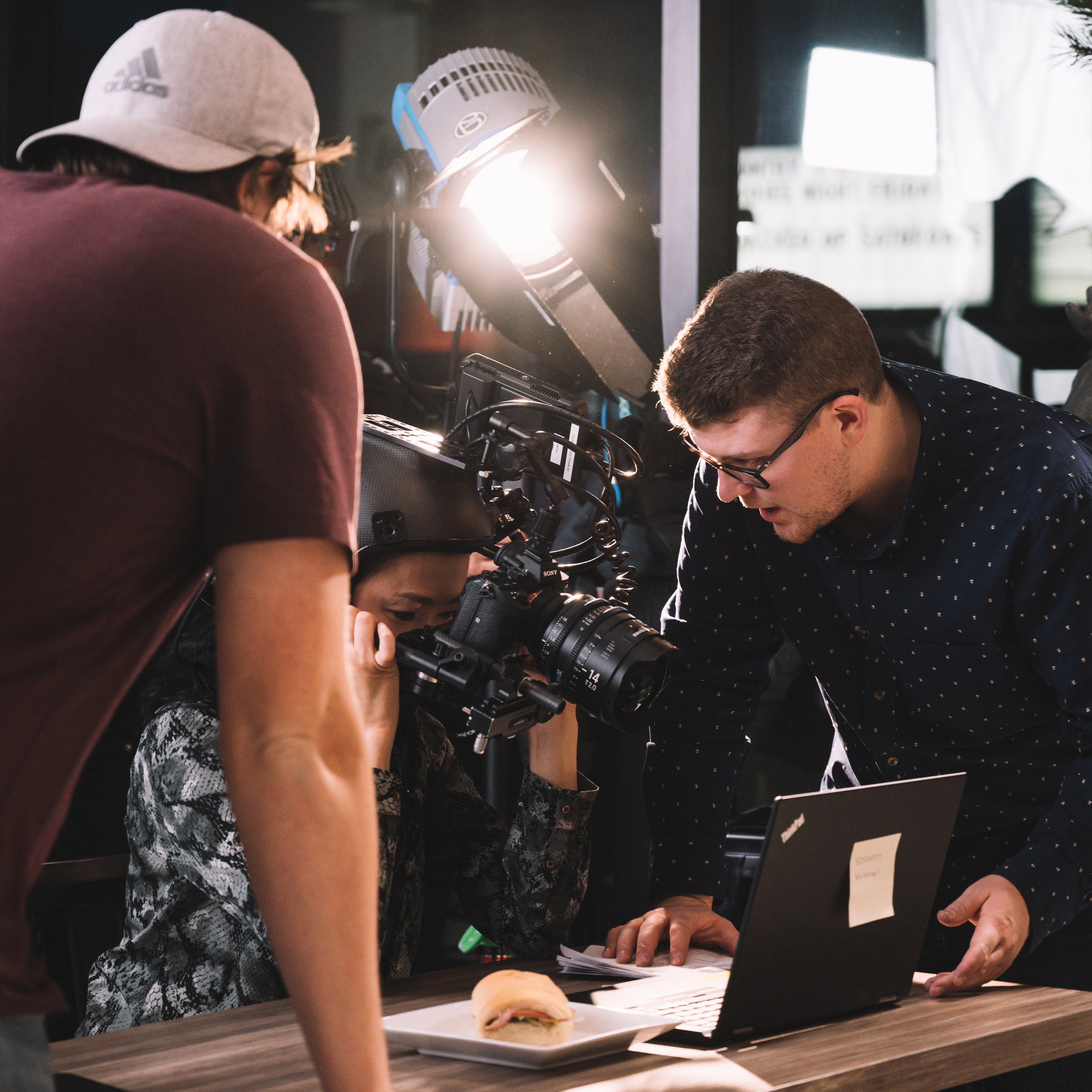 Brandon Hardy and Dave Hiff directing on-camera talent wearing a custom POV helmet rig with a wide lens