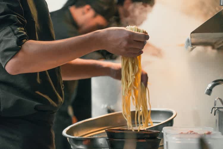 Chefs at work preparing ramen noodles in London