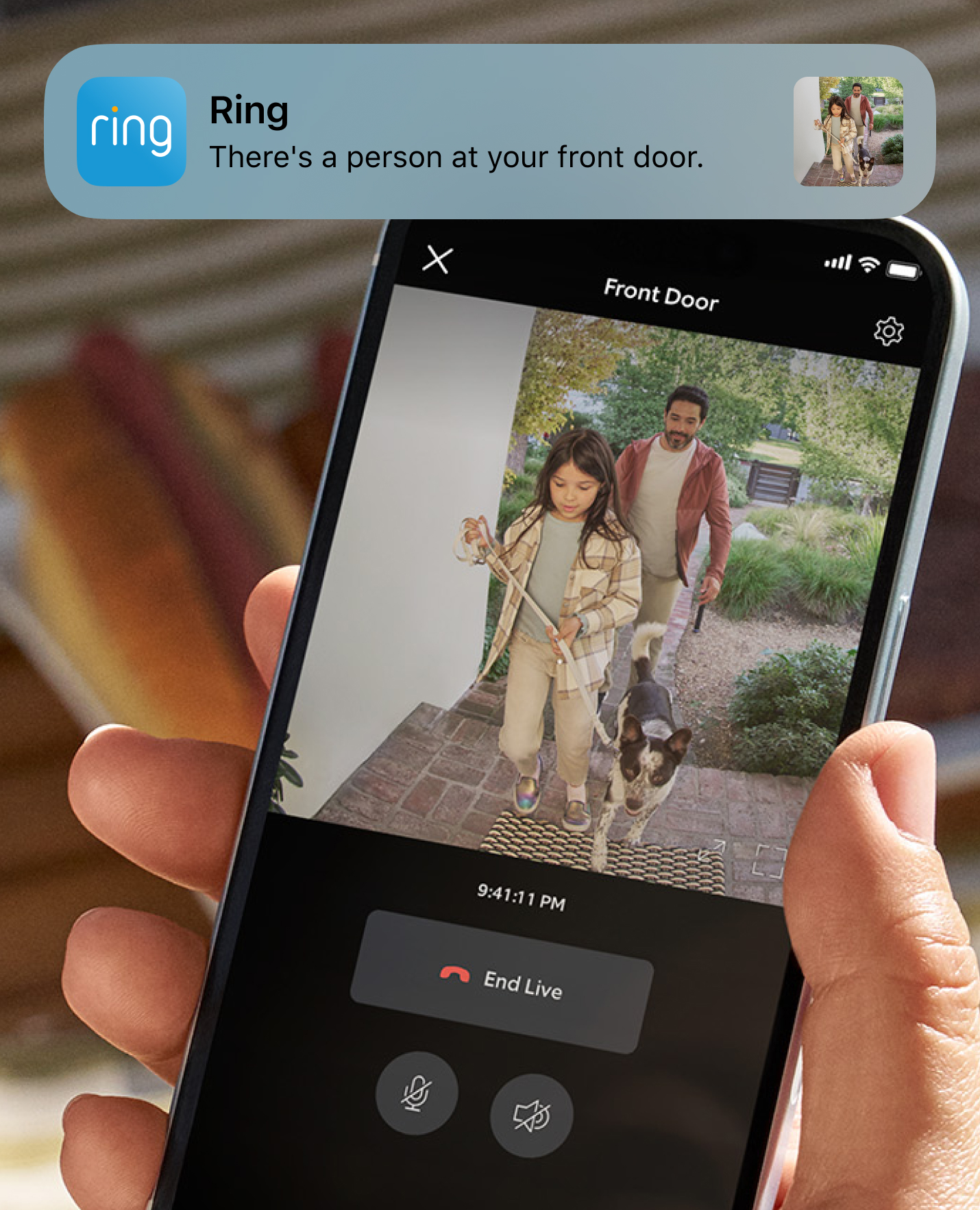 Phone shows Ring alert and live video of girl holding dog leash as she arrives with man and dog and front door.
