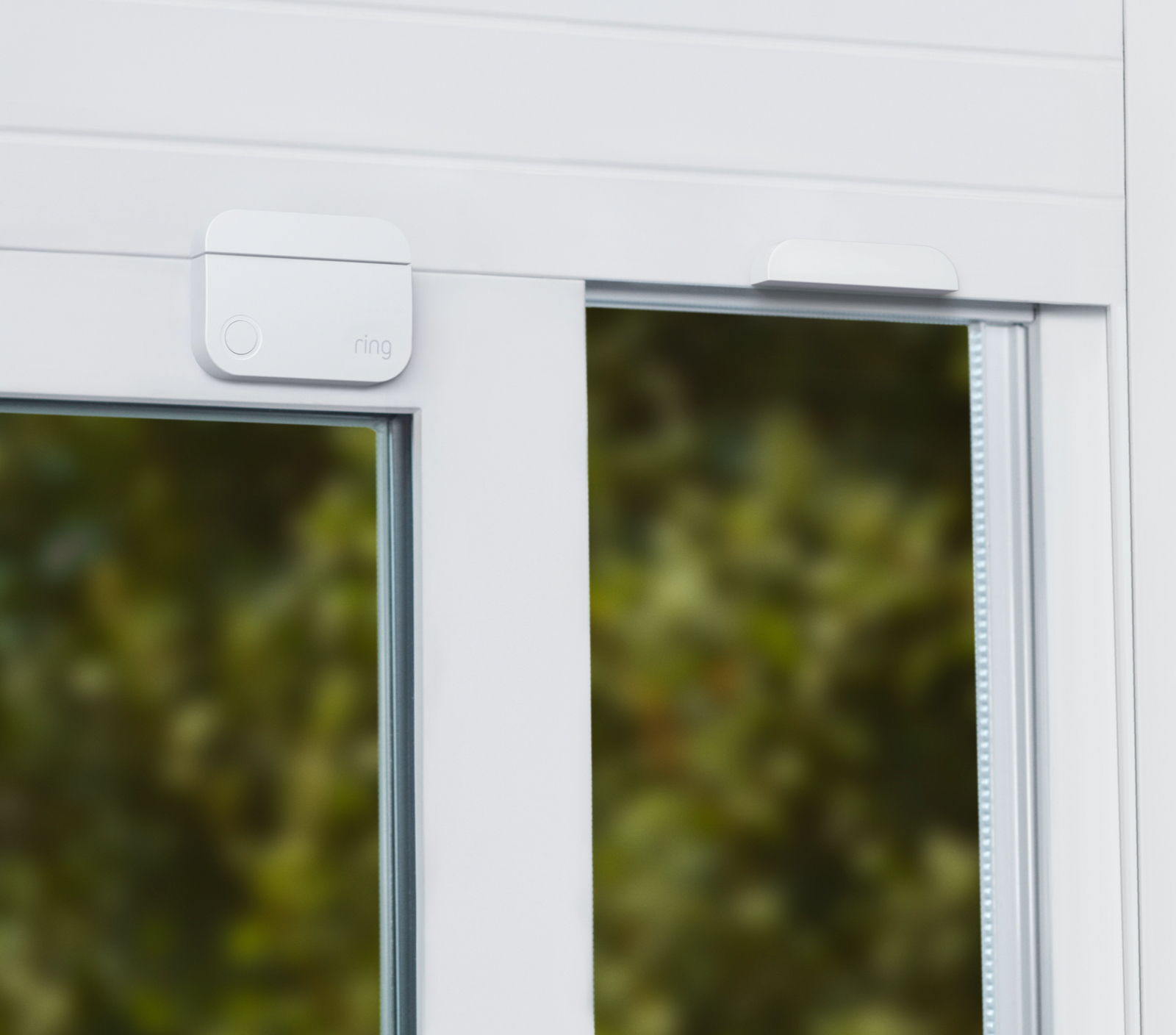 Ring Open Window Magnet installed on white sliding window frame to monitor open or tampered windows for security alerts.