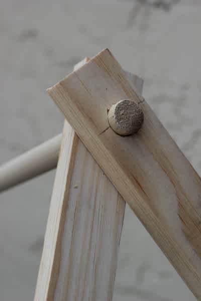 Inserting-the-Dowels-for-the-Collapsible-Play-Tent-400x600