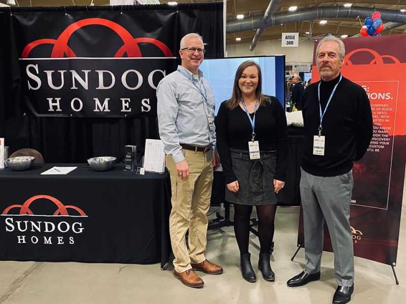 The Sundog Homes team standing in front of the event booth at the 2020 AHBA Build & Remodel Expo