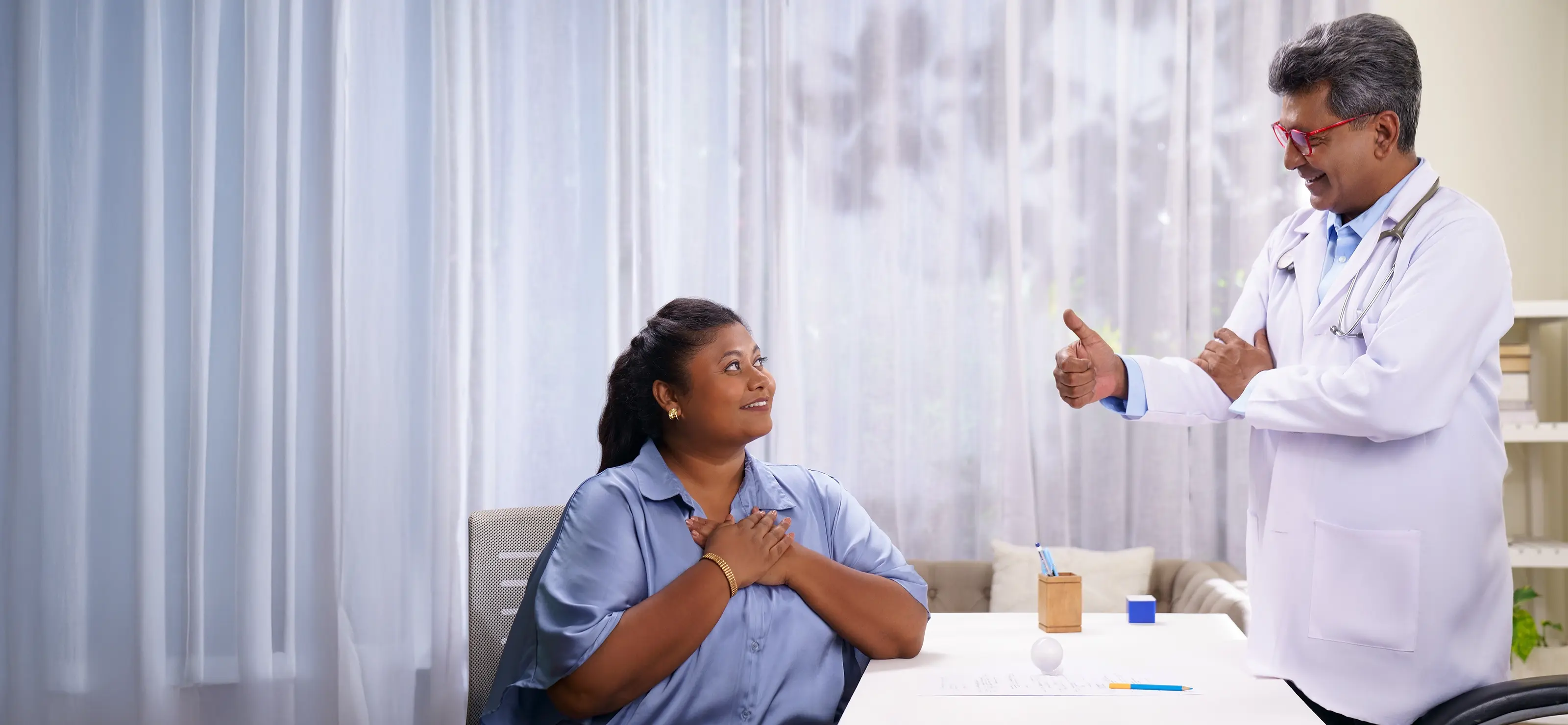 A female patient with obesity having a positive consultation with her doctor, illustrating the importance of speaking with a healthcare provider about weight management options.