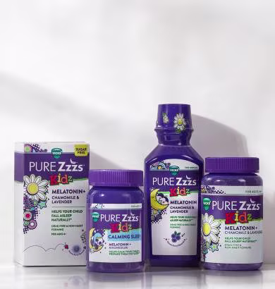 ZzzQuil Pure Zzzs Kidz sleep aid range displayed on white background, including melatonin-based gummies, calming sleep supplements, and liquid formula, all formulated with chamomile and lavender.