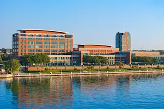 Exterior photo of 200 Walker in its entirety, featuring the riverfront.