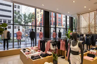 An interior photograph of Alo at Hudson’s Detroit showcasing merchandise.