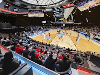 An interior photograph of the Cosm venue in LA showcasing a basketball game.