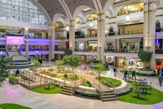 An interior photograph of Skylight Park and retail tenants at Tower City Center.