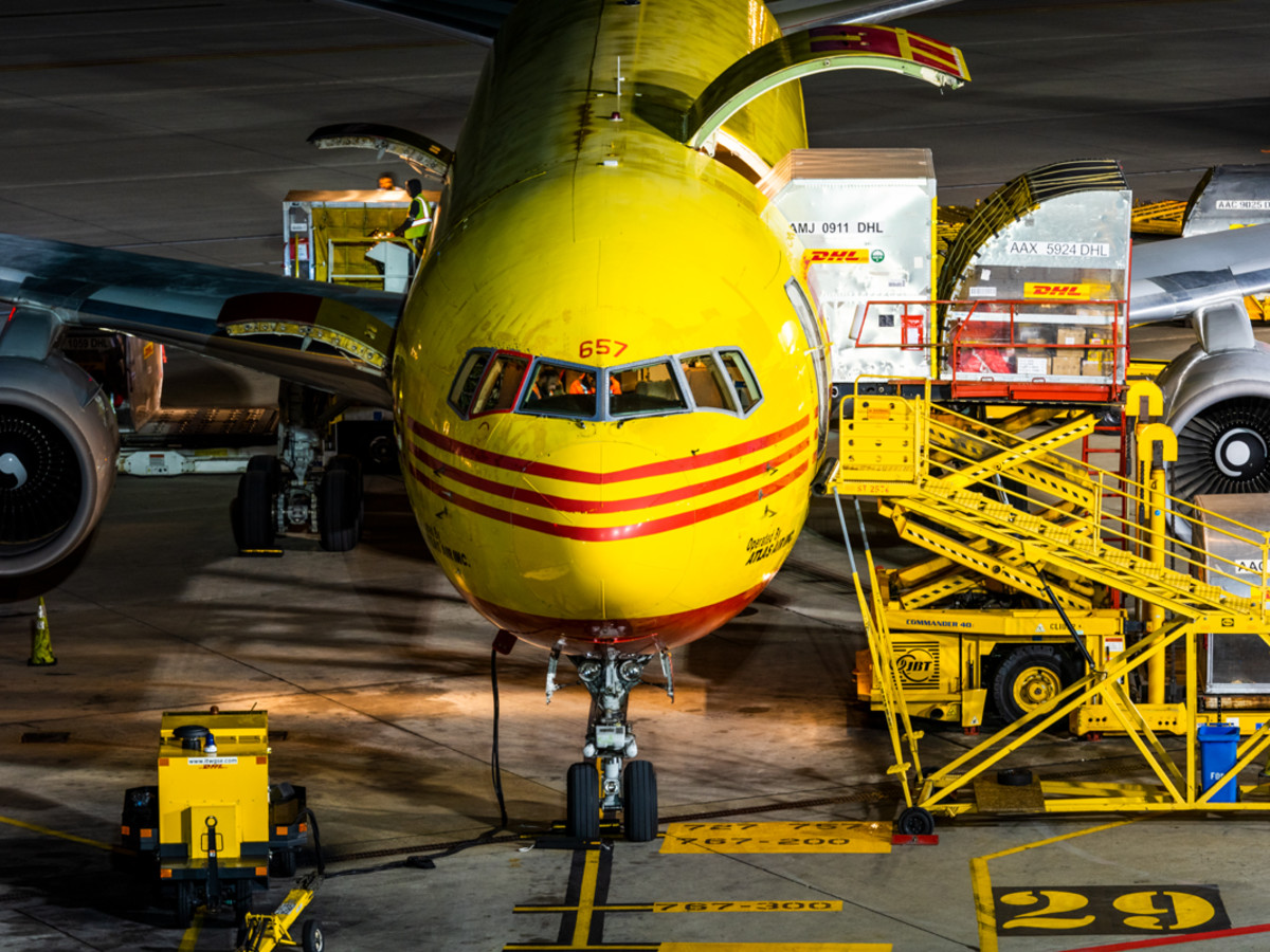 A photo of a DHL plane being loaded.