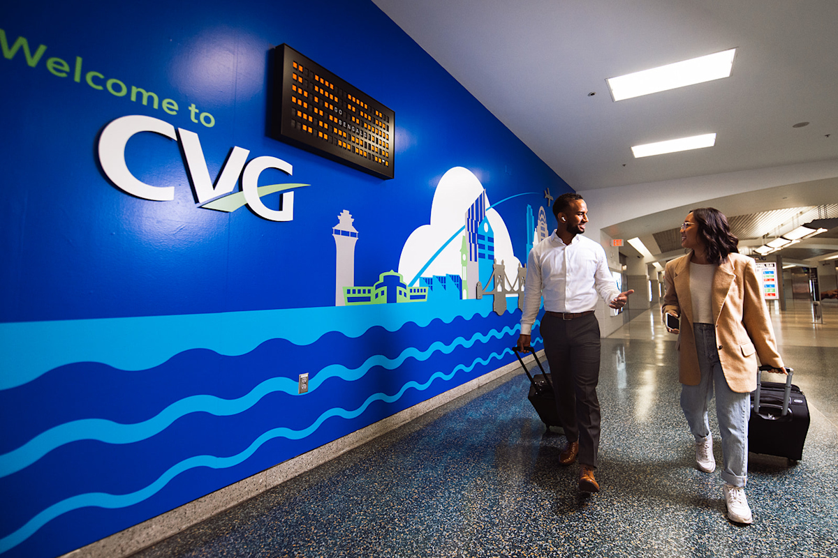 Media - Welcome to CVG sign and travelers