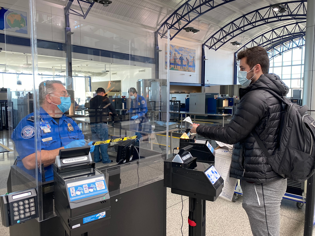 Passenger in TSA Line Interacting with TSA Agent