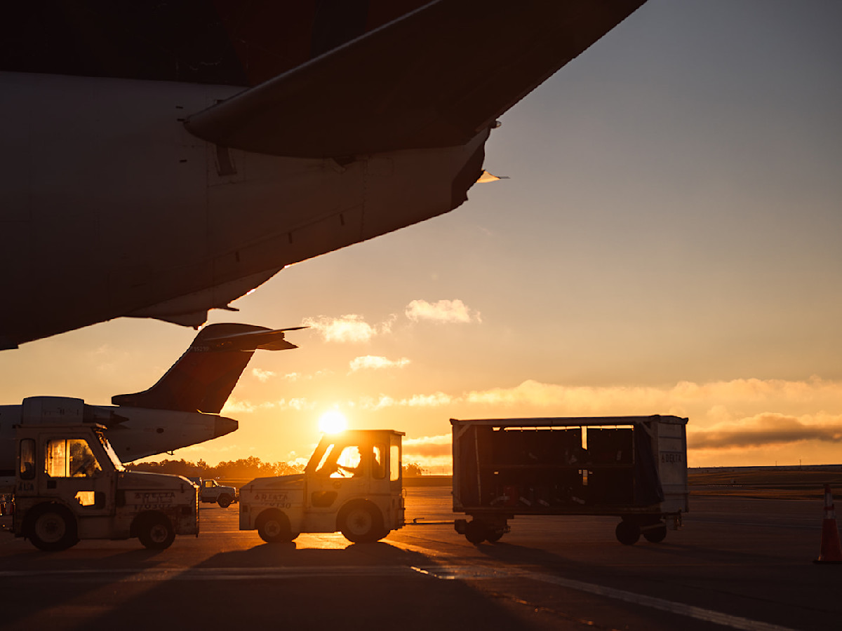 Image of a plane being loaded at night