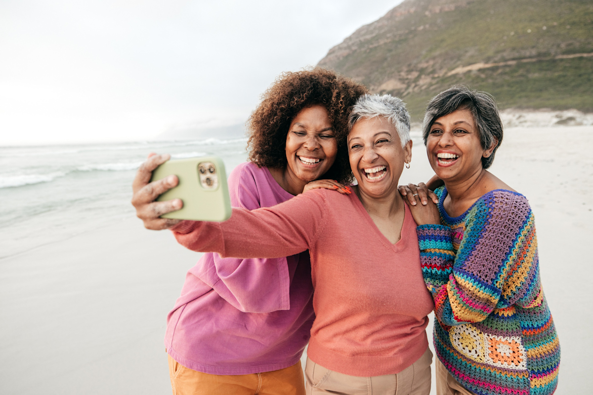 Three Women Taking a Selfie on the Beach