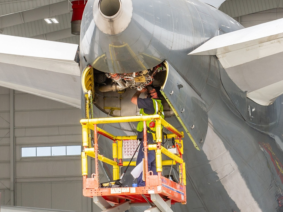 An aviation mechanic working on a plane.