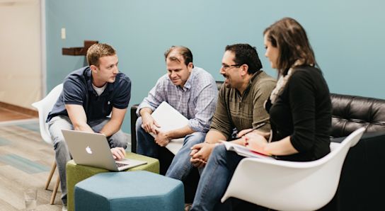 Group on couch working together
