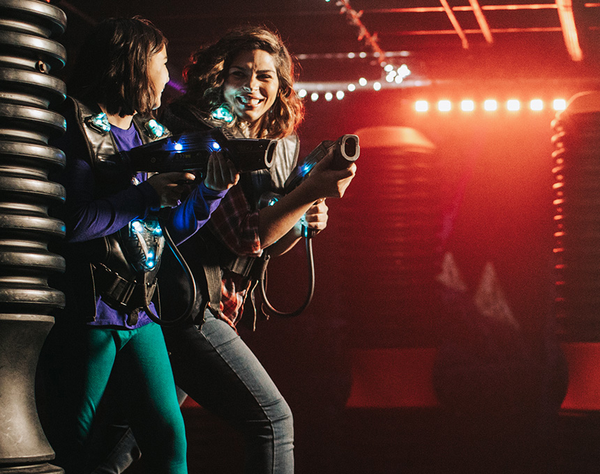 Two people playing laser tag