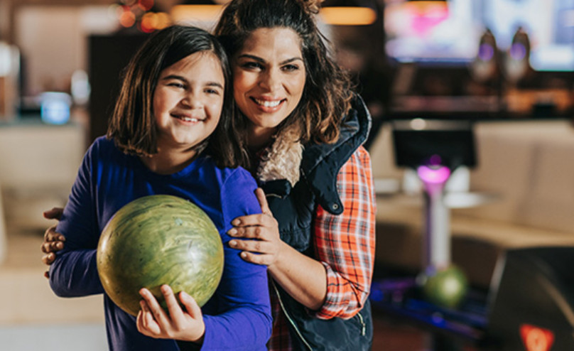 Mom and daughter bowling