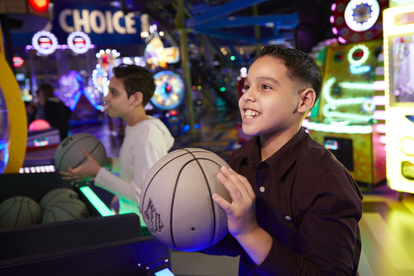 Kids playing games in the arcade