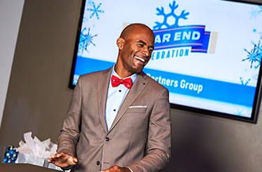Man in suit laughing