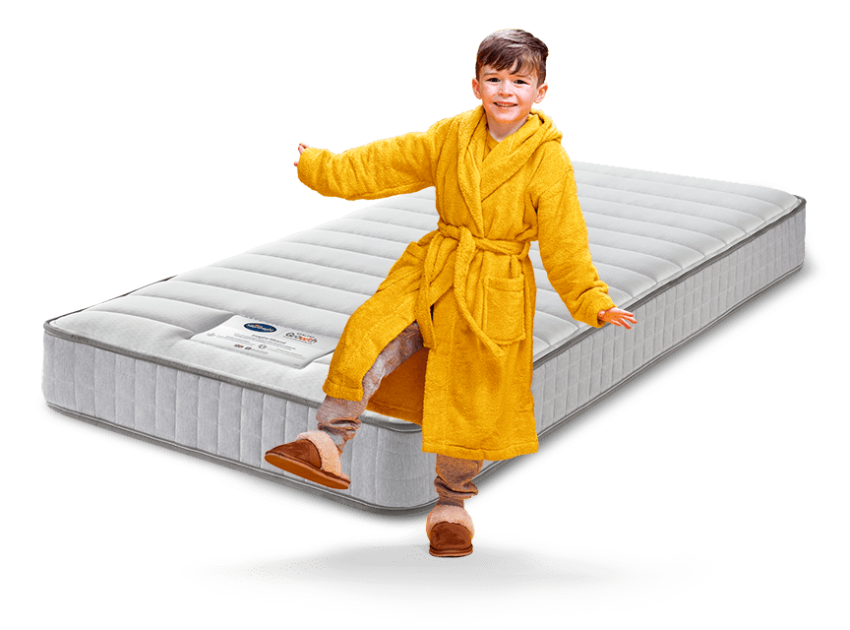 boy in yellow dressing gown with mattress