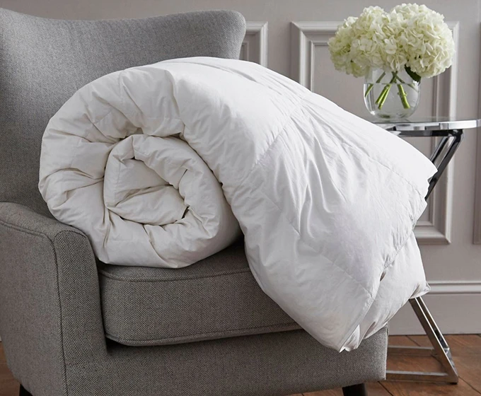 A duvet rolled up on a chair