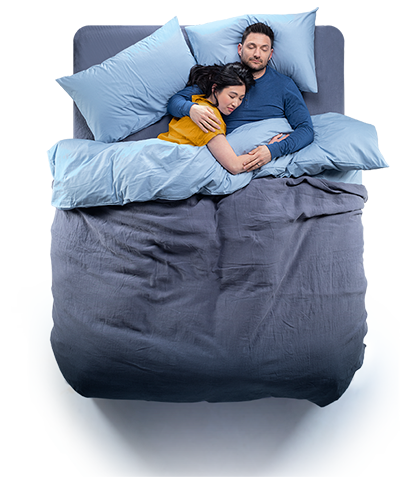 Top down view of a couple sleeping in a Silentnight Essentials bed - Grey