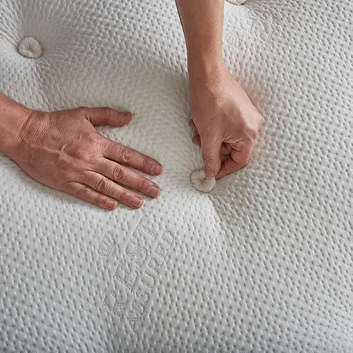 hand detailing top of mattress
