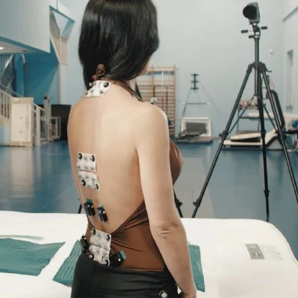 Woman with sensors on her back