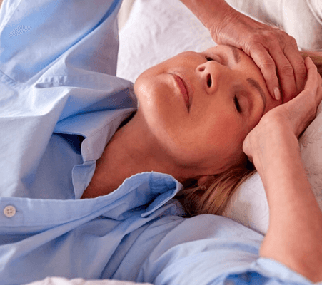 woman experiencing menopause symptoms