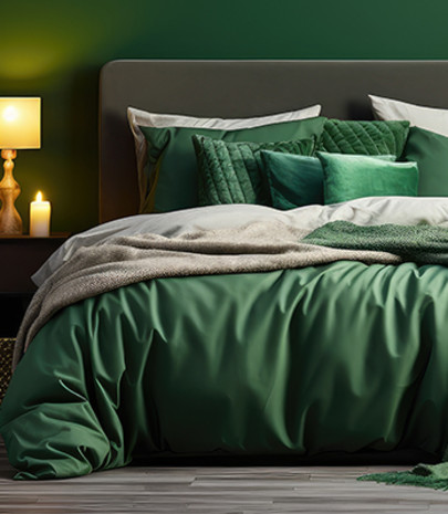 A cosy bed with multiple layers in emerald green
