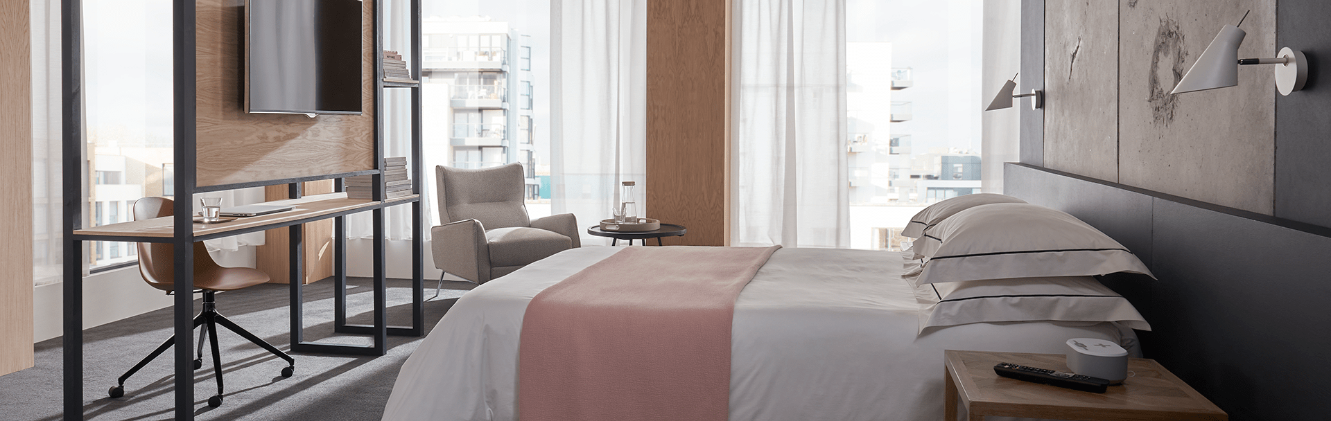 Business hotel room with desk and television screen