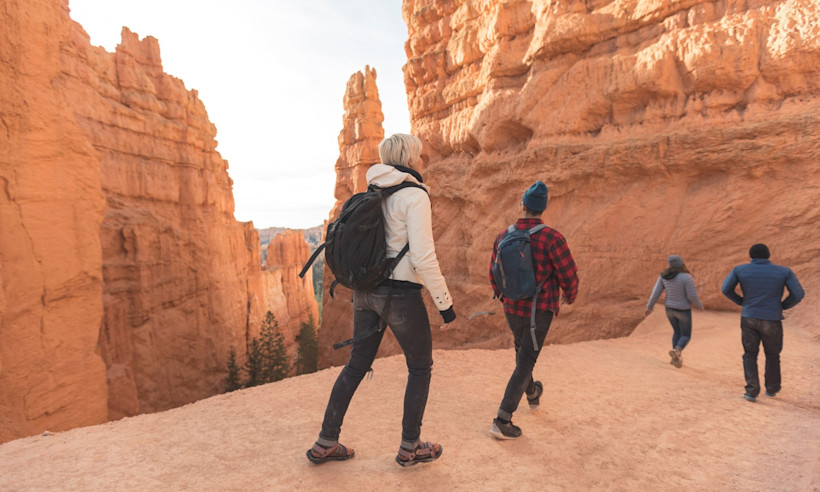 Hikers on Wall Street, the beginning portion of the Navajo Loop.