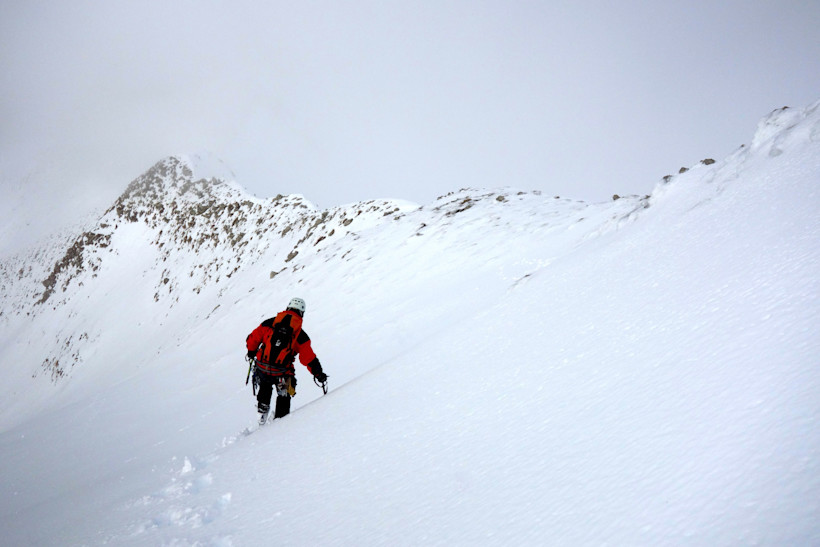 Mountaineer climbing a mountain