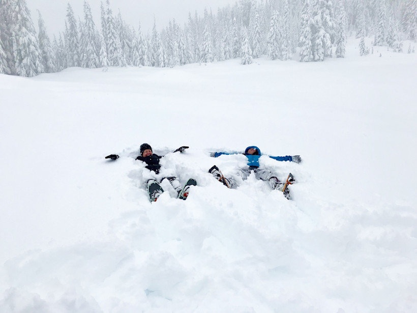 Snowshoers making snow angels on Skyline trail.