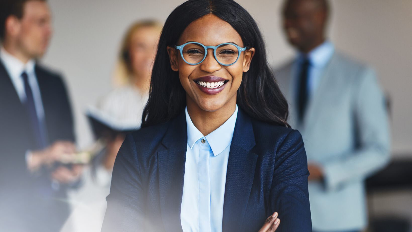 Black female lawyer in foreground with diverse group in the background