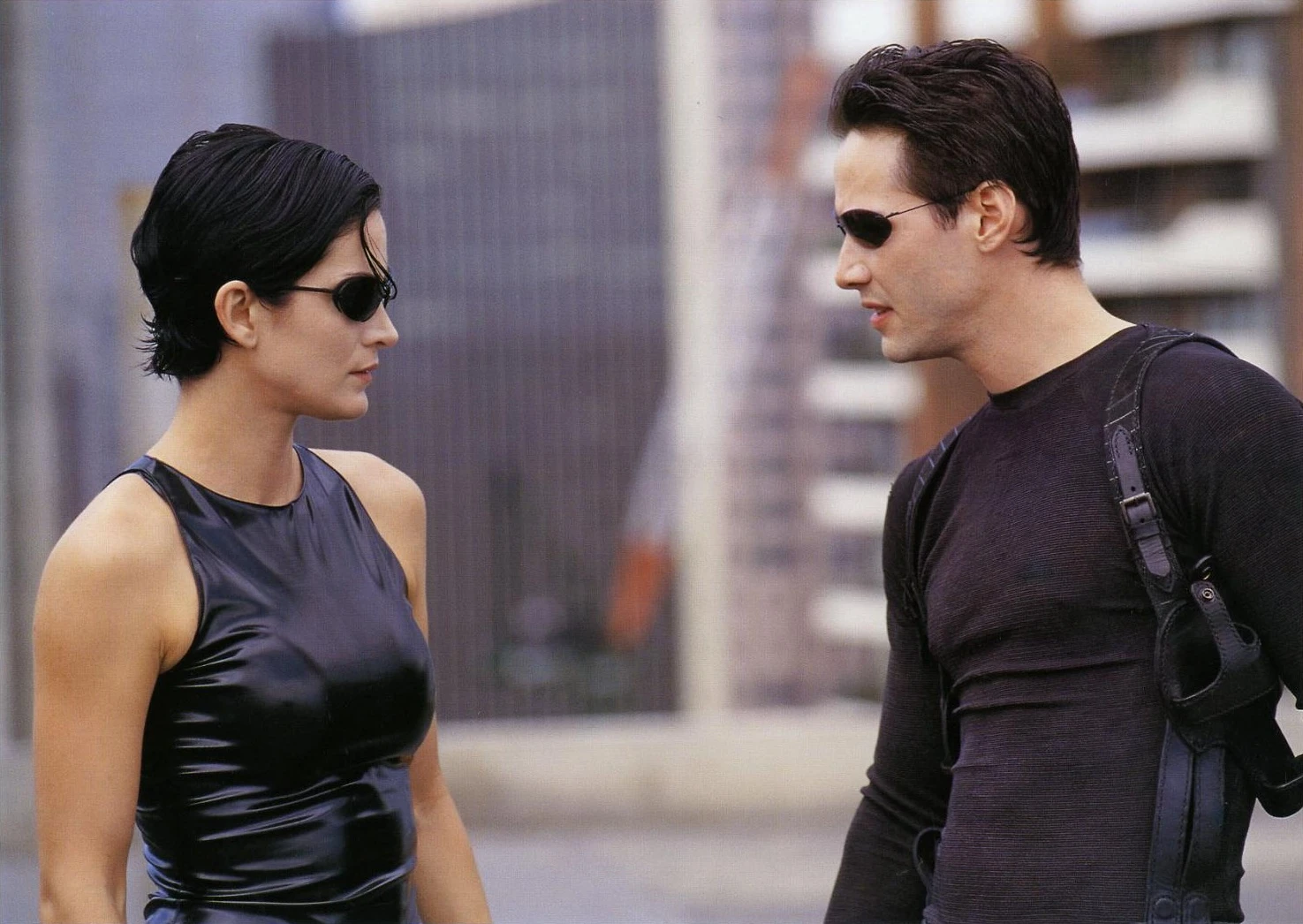 Carrie-Anne Moss as Trinity and Keanu Reeves as Neo