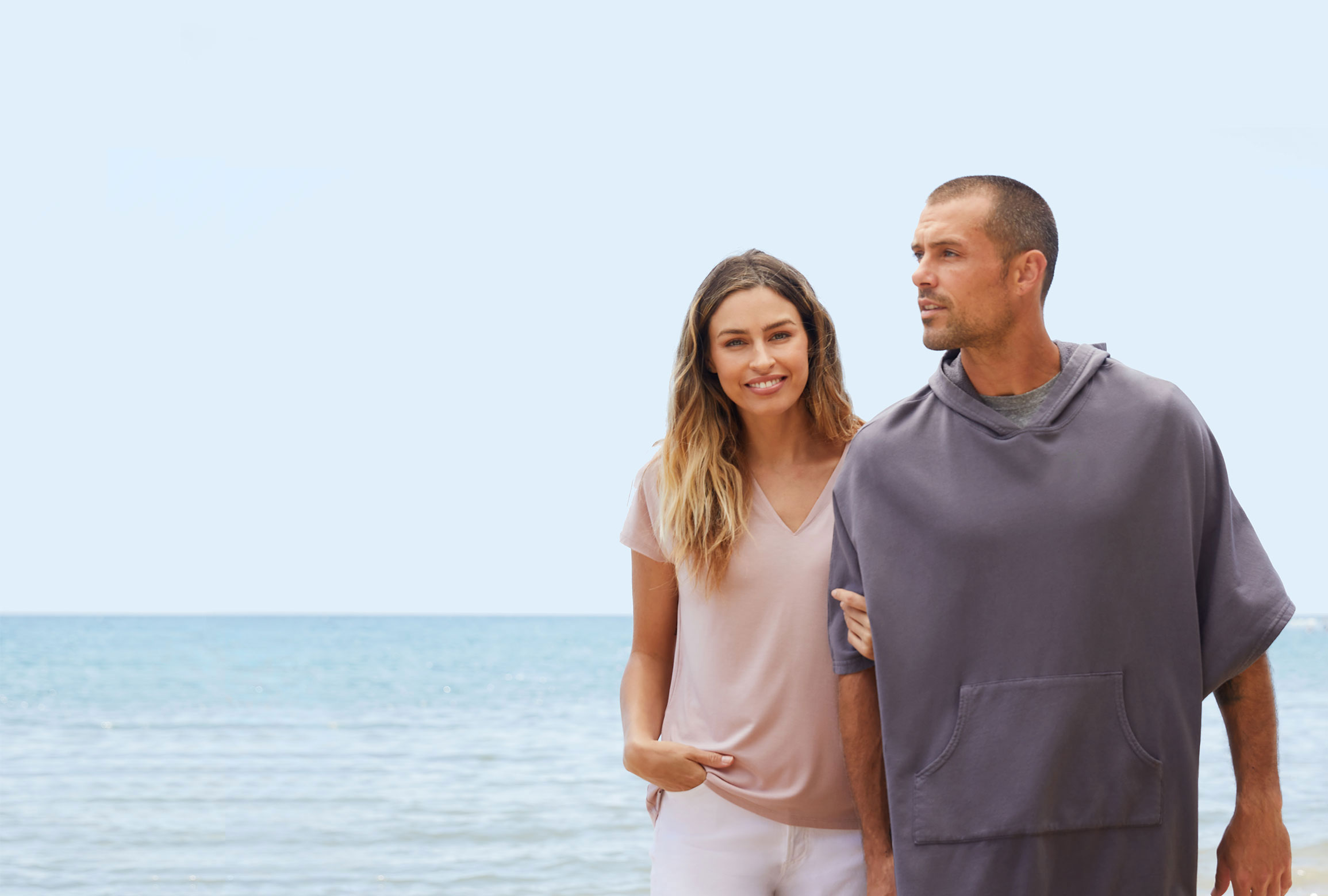 Couple walking on the beach.