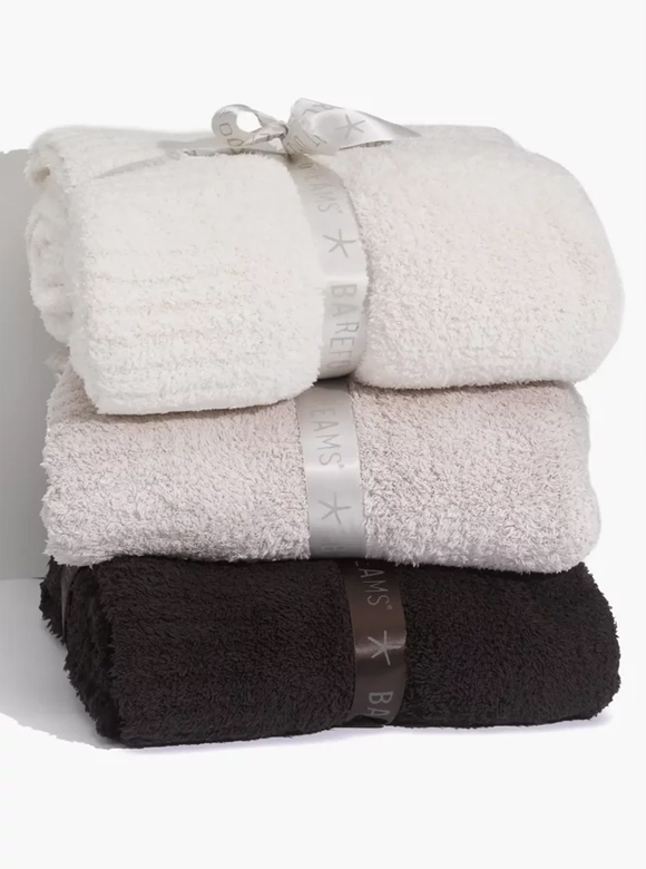 Stack of three CozyChic Throws.