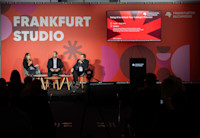 A photo of Audible's Sadaf Kazmi and Lee Jarit in conversation at Frankfurt Book Fair 2025.