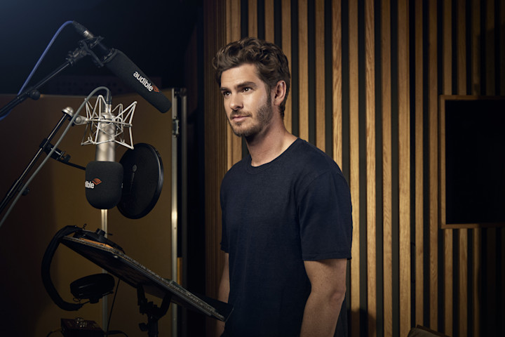 A photo of Andrew Garfield behind the microphone as he performs for "George Orwell's 1984."